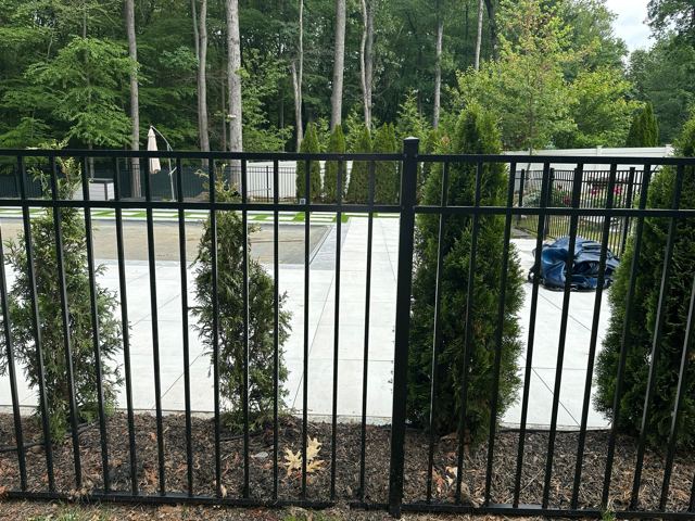 Concrete Patio & Aluminum Fence — After
