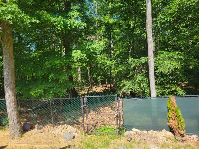 Concrete Patio & Aluminum Fence — Before
